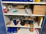 a blue cabinet with many items on it in the room