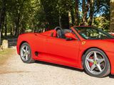 a red sports car that is parked on the side of the road