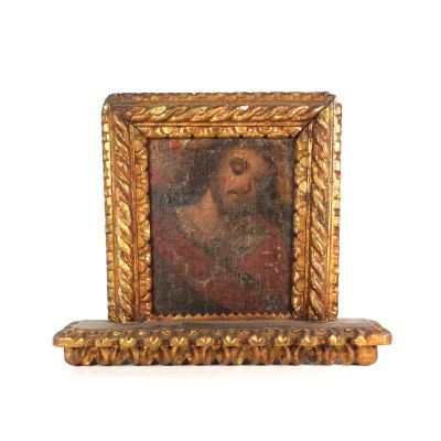 a picture of a picture of jesus in a gold frame