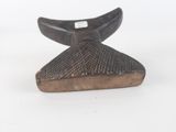 wooden sculpture of a whale fin on a white background