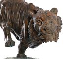 statue of a tiger on a marble base on a white background