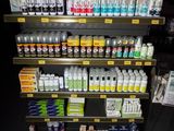 a display of various types of paint in a store