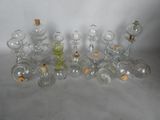a lot of glass bottles with corks on them
