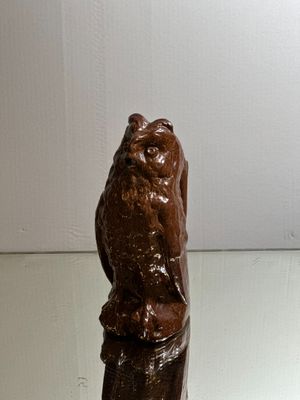 a statue of an owl sitting on top of a table