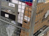a metal cart with a lot of items inside of it
