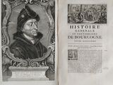 an old book with a picture of a man wearing a hat