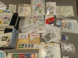 a lot of stamps and postcards on a table