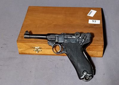 a gun that is sitting on top of a wooden box
