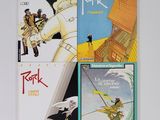 trois livres posés sur une surface blanche ; l'un est un livre et l'autre est une bande dessinée