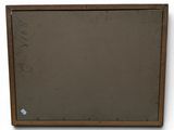 a painting of a brown frame with writing on it on a white wall