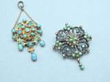 two small pendants with turquoise and gold beads on them