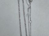 a close up of a pair of necklaces on a white surface