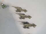 a lot of toy guns that are laying on the floor