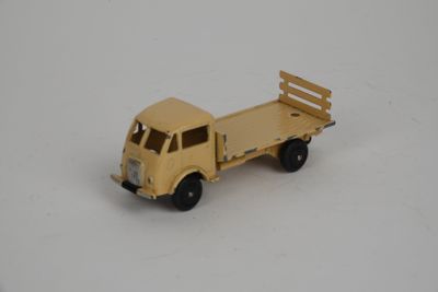 a toy truck that is sitting on a white surface