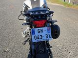 a motorcycle that is parked on the side of the road