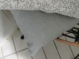 a chair that has a pillow on top of it