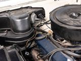 a car engine with the hood up and the hood down