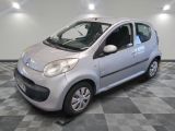 a picture of a small silver car on a checkered floor