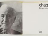 an open book with a picture of an old man on it