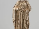 a silver statue of a woman with a veil on her head