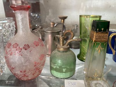 many glass vases on display in a glass case