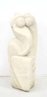 a white sculpture of a bird sitting on top of a table