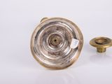 a small metal object that is sitting on a table