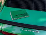 a book on the back of a green car