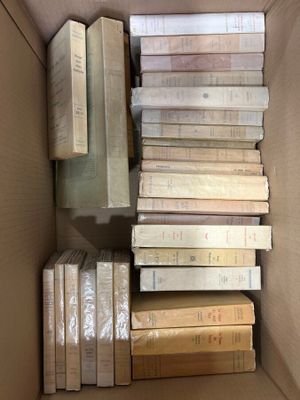 a box full of books sitting on top of a table
