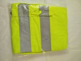 a close up of a yellow shirt with reflective stripes on it
