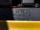 a close up of a yellow box with a black lid