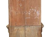 a tall wooden cabinet with a door on the top