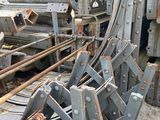 many pieces of metal that are stacked together on the ground