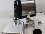 a picture of a blender and a flask sitting on a table