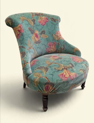 a blue chair with a floral pattern on it