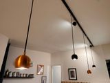 three lights that are hanging from the ceiling in the room