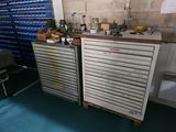 two metal drawers that are next to each other in a room
