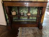 a wooden table with a glass shelf on top of it