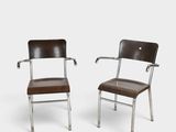 a pair of chrome and leather chairs