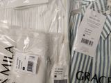 a lot of clothes that are in a plastic bag