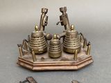 a miniature model of a steam engine on a stand