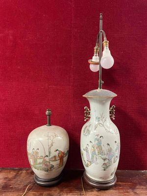 two vases sitting next to each other on a table