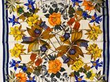 an image of a square scarf with flowers and leaves on it