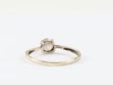 an image of a white diamond ring on a white background