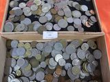 a lot of coins in a box on a table