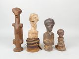 three wooden sculptures of different shapes and sizes on a white surface