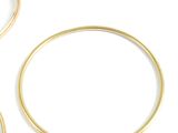 three gold rings on a white background with a white background
