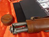 a leather case with a leather handle and a leather case with a leather handle