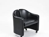 black leather chair on casteors against a white background
