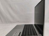 an open laptop computer sitting on top of a white table